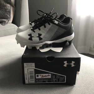 Brand new in box, never worn. UA cleats, size 13.